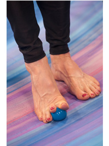 Exercising feet with ball to help somatosensory system