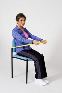 Abdominal strengthening in the chair with a resistance band.